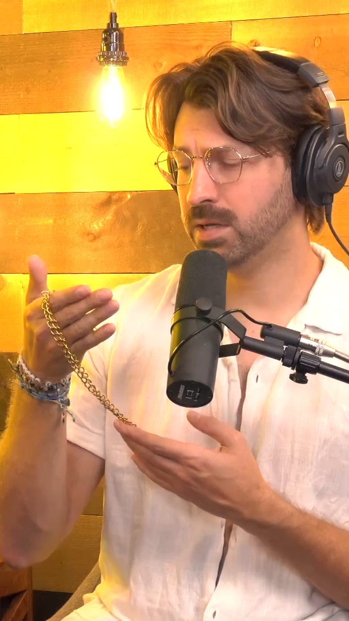 A character sings while holding up a gold chain, the kind of prop your product could replace
