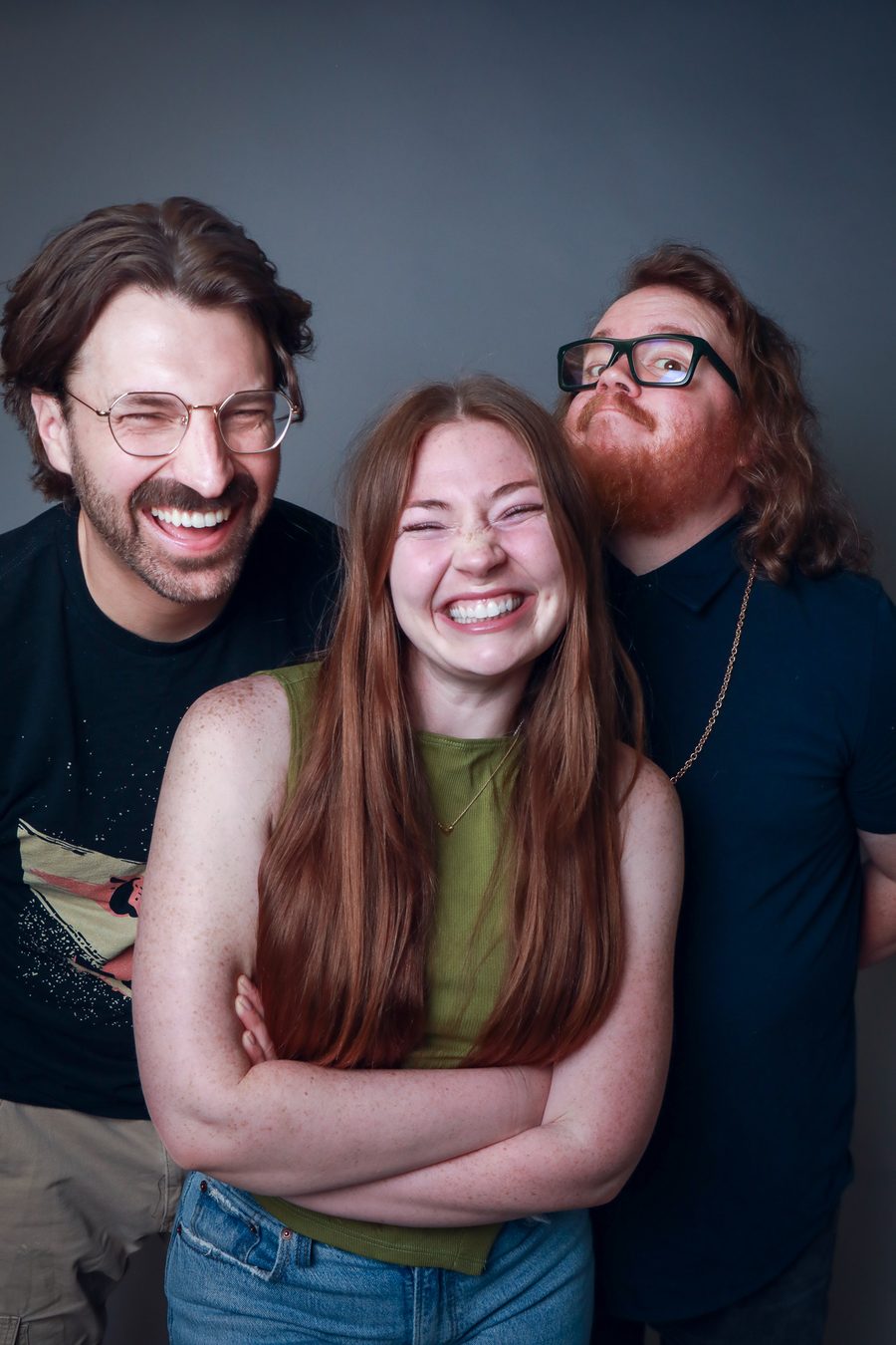 Zach Atherton, Shae McCombs, and Caleb Wall laughing together